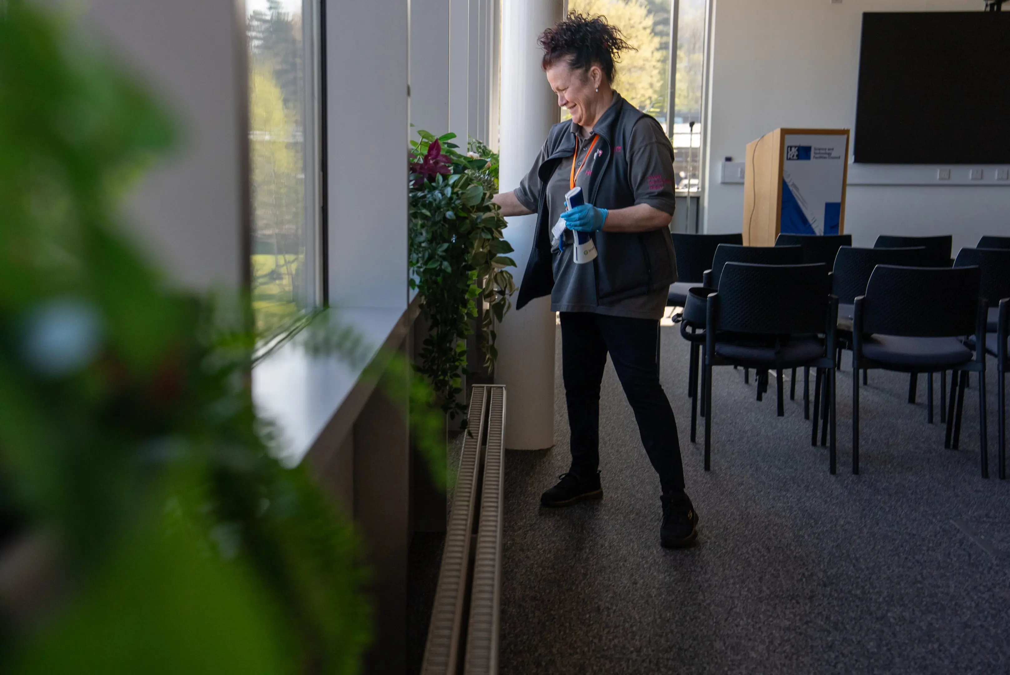 Commercial cleaning operative maintaining office environment within UK research facility