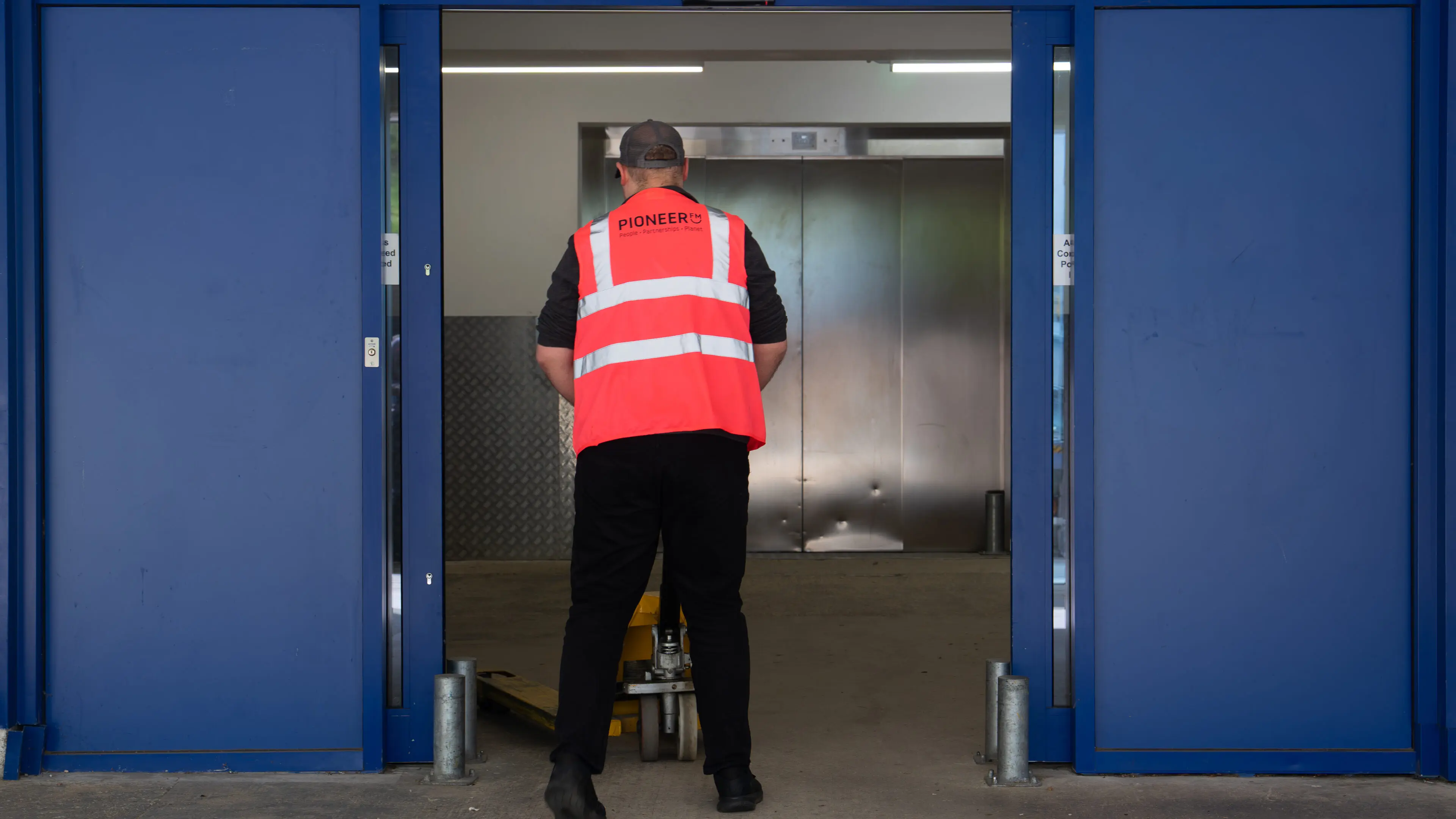 Pioneer FM operative delivering on-site logistics support in a secure commercial facility in the UK