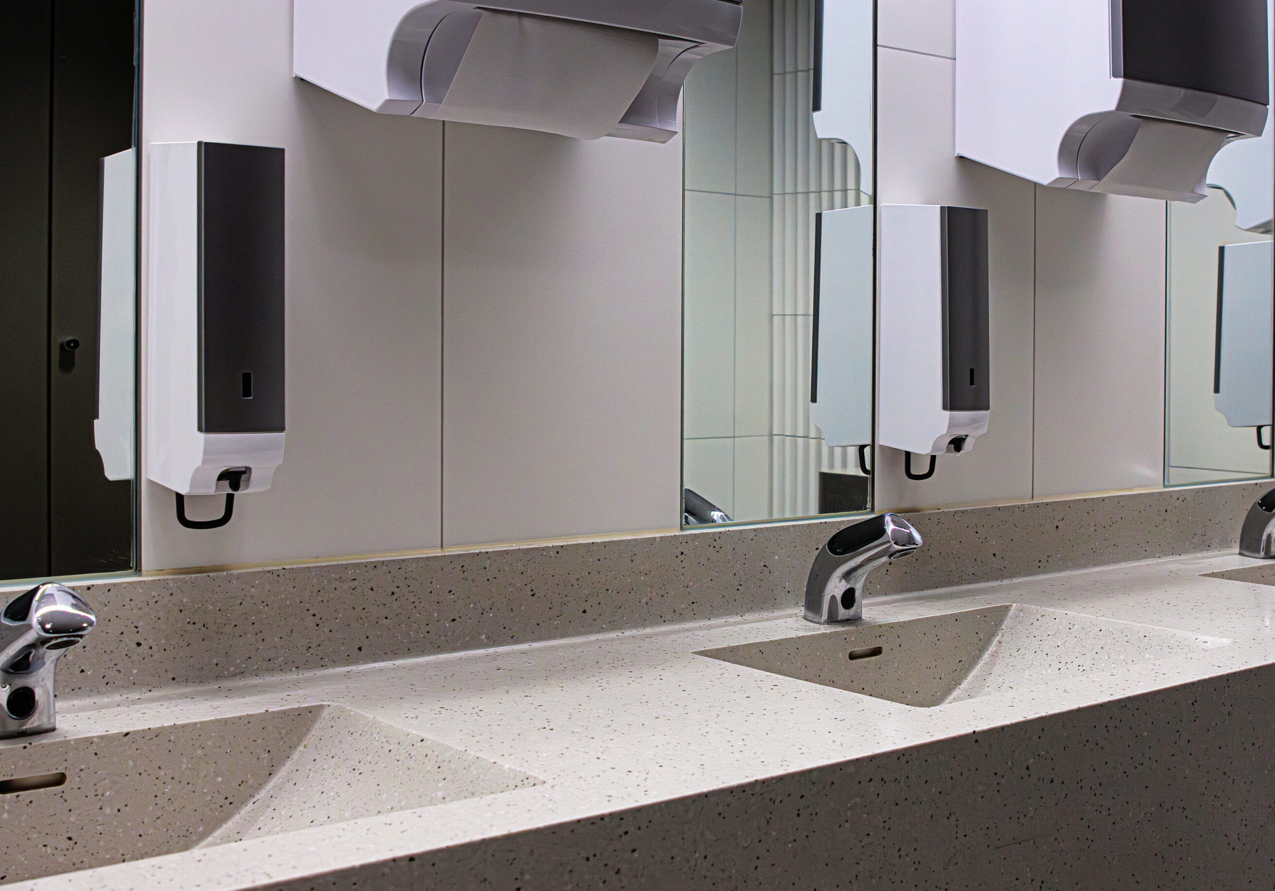 Professional washroom cleaning and hygiene maintenance in a high-traffic commercial facility