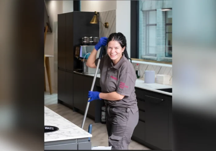 Commercial cleaner disinfecting office desk – Pioneer FM UK